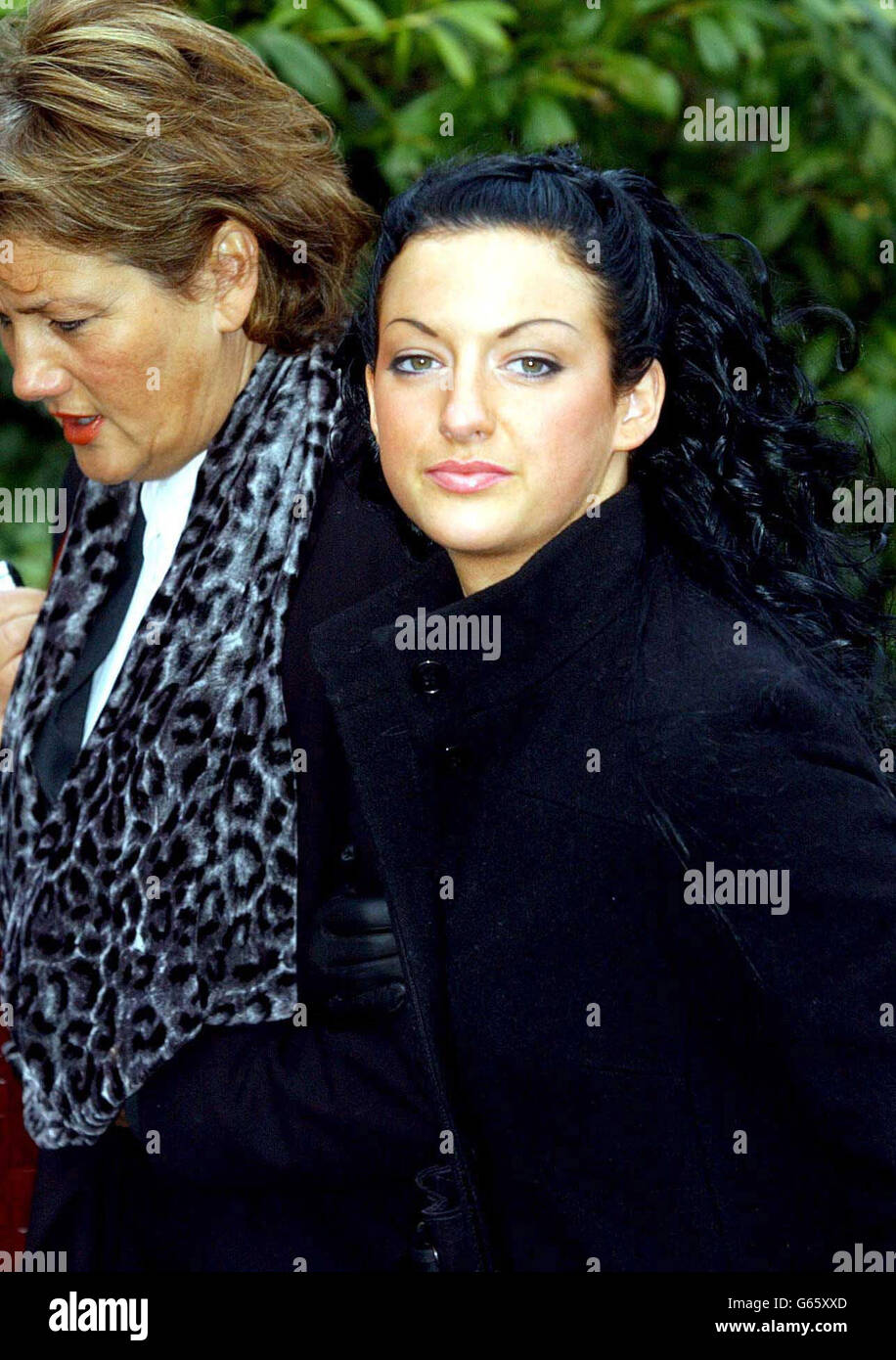 Former Miss World contestant, Sophie Cahill (right), arrives at Newport (Gwent) Crown Court to deny a bottle attack on another woman in a nightclub. Ms Cahill, 19, who won the Miss Wales contest in 2000, is accused of wounding with intent to inflict grievous bodily harm. * .... and an alternative charge of wounding in November 2002 in the Jimmy Dean night spot in Chepstow, South Wales. Stock Photo