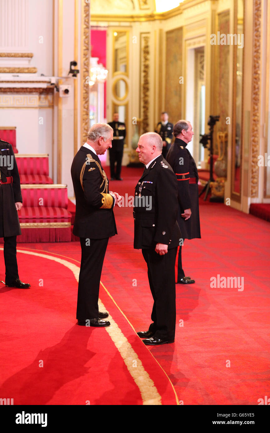 Mr. Michael Cunningham, Chief Constable, Staffordshire Police, is decorated with The Queen's Police Medal by the Prince of Wales at Buckingham Palace. PRESS ASSOCIATION Photo. Picture date: Friday June 7, 2013. Photo credit should read: Dominic Lipinski/PA Wire Stock Photo
