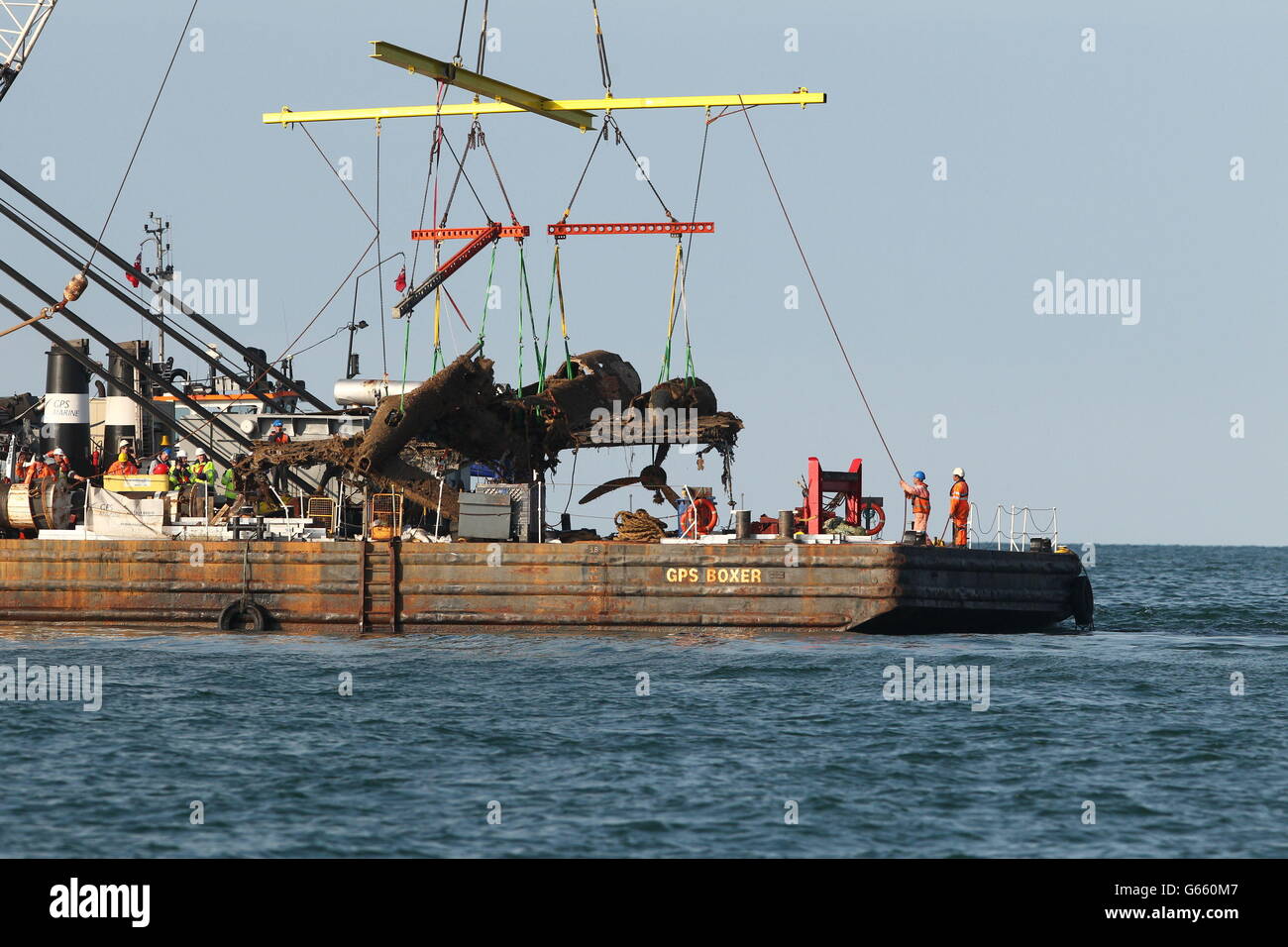 Lifting equipment raises a World War II Dornier bomber, the only surviving German Second World War Dornier Do 17 bomber, from the English Channel. Stock Photo