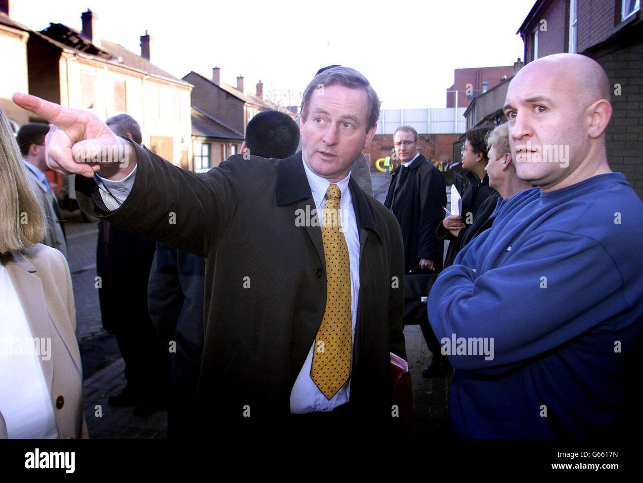 Fine Gael Leader Enda Kenny (left) chats with residents of Cluan Place in East Belfast, during his visit to the loyalist side of the peace line. * After meeting residents in Cluan Place, which has seen some of the worst rioting in Belfast over the past year, Mr Kenny said: I think we should focus in on the real areas of dissent and on areas where we feel we can make a breakthrough. Stock Photo