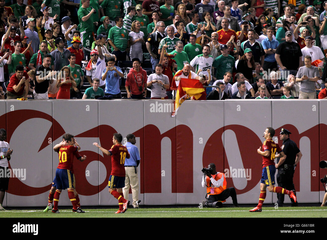 Spain's Juan Mata (hidden left) celebrates scoring with team-mates during the International Friendly at Yankee Stadium, New York, USA. Stock Photo