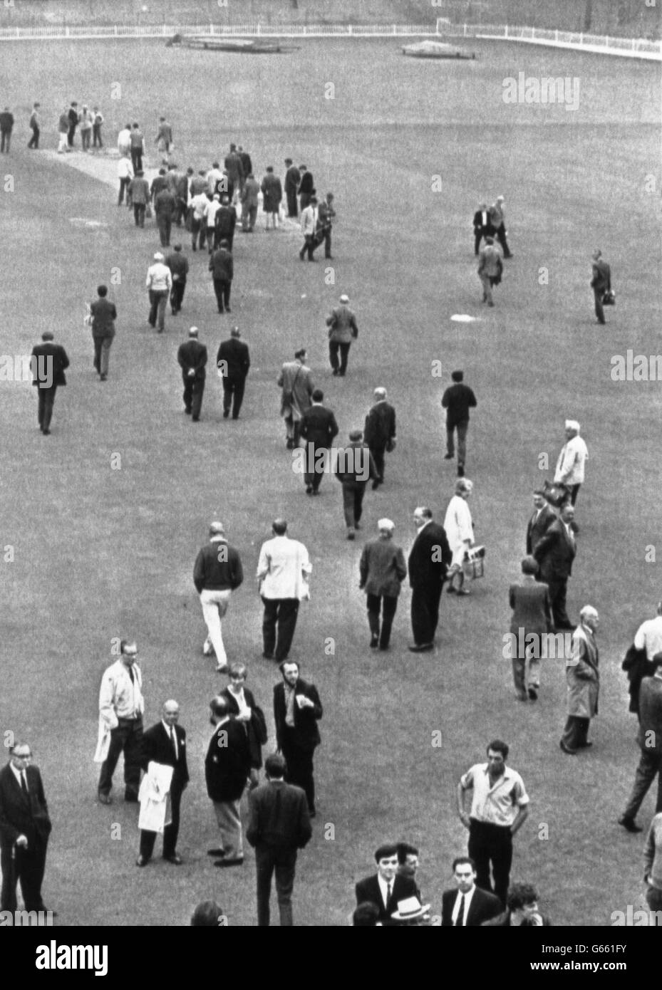 Yorkshire cricket fans walk out on to the pitch at Bramall Lane in Sheffield, after Australia were defeated. Stock Photo