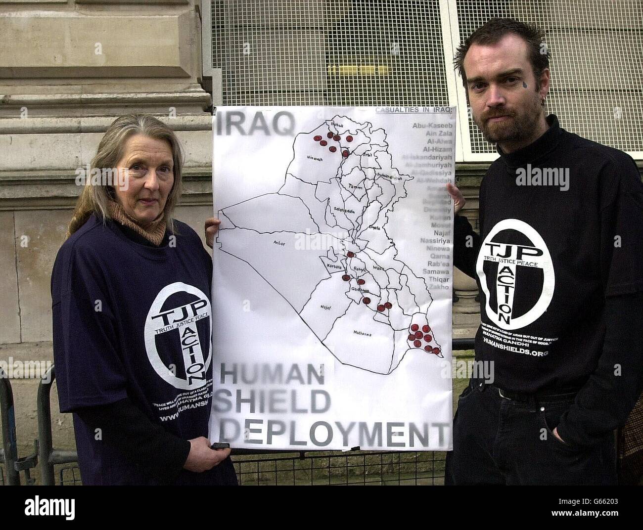 Human shield volunteer, Sue Darling, from Guilford, Surrey with fomer US Marine, Ken O'Keefe founder of Human Shield Action to Iraq, holding a map of Iraq showing human shield deployment's, outside Downing Street, London. Stock Photo