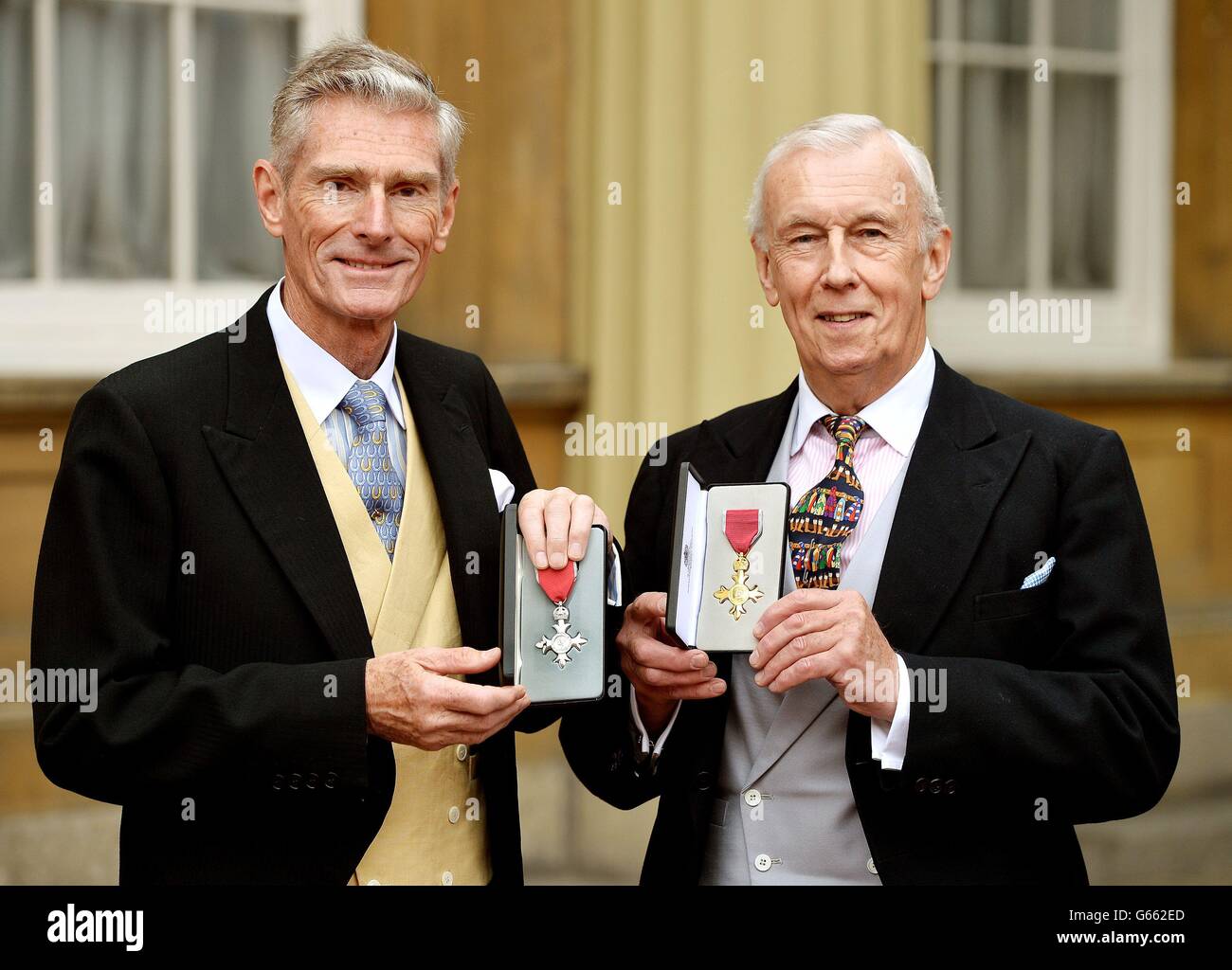 Norman Gundill (left) proudly holds his MBE (Member of the British Empire) Medal, with John
