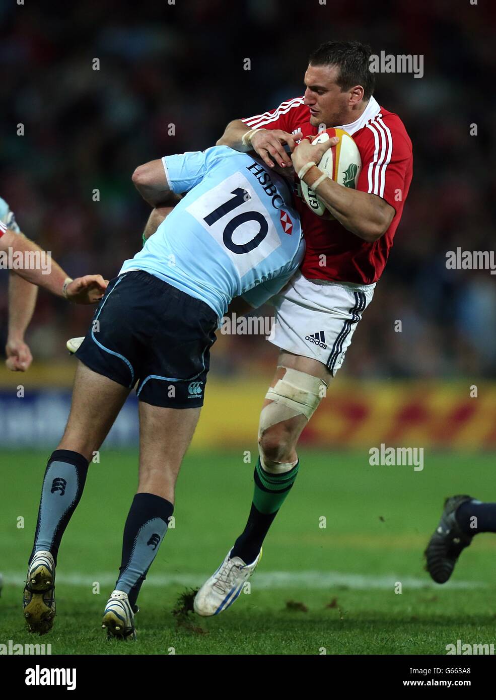 British & Irish Lions' Sam Warburton gets tackled by NSW Waratahs Bernard Foley Stock Photo