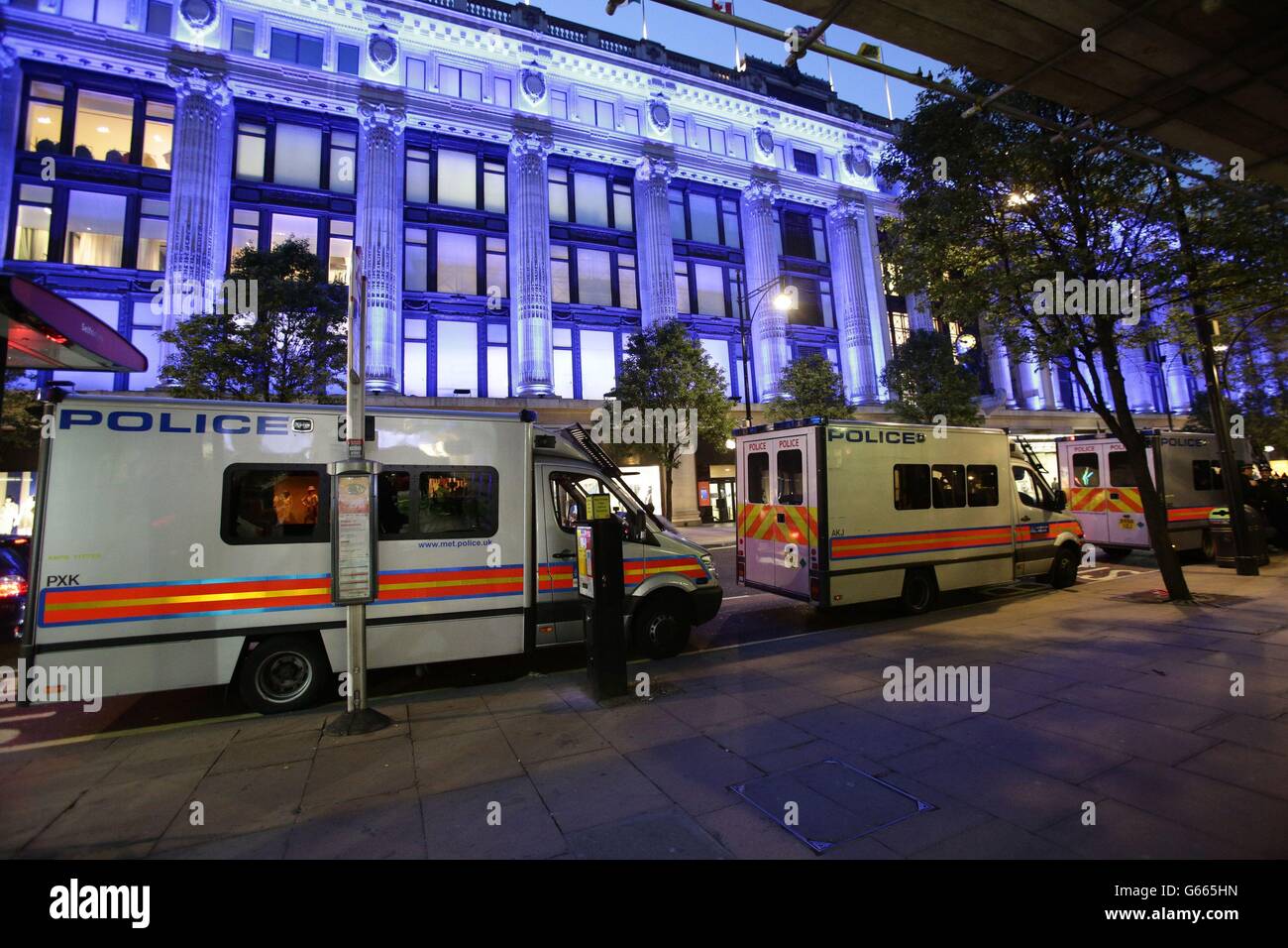 Police vans at the scene of a smash and grab robbery in Selfridges, Oxford Street, London. Stock Photo
