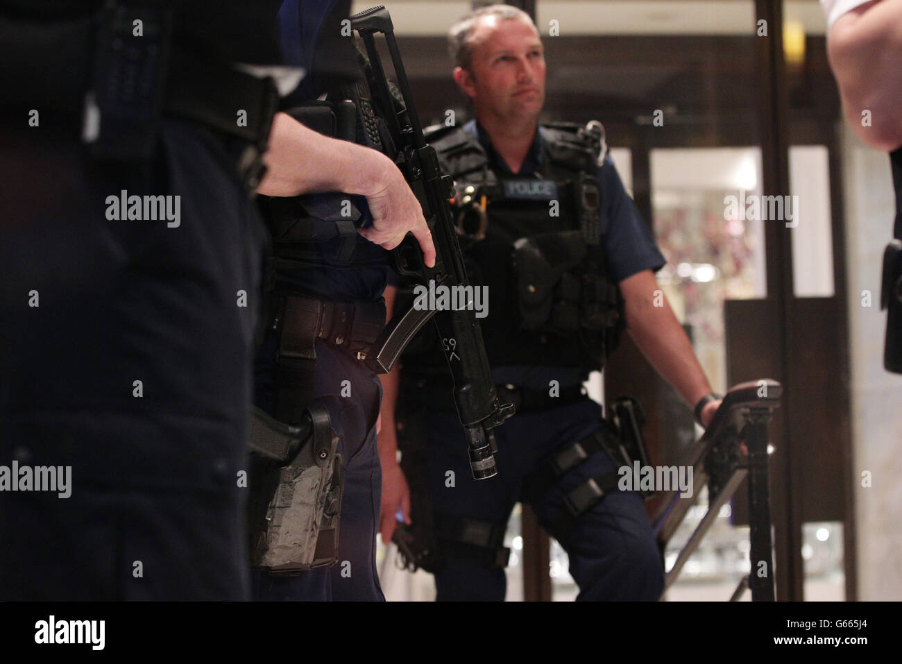 Police officers at the scene of a smash and grab robbery in Selfridges, Oxford Street, London. Stock Photo