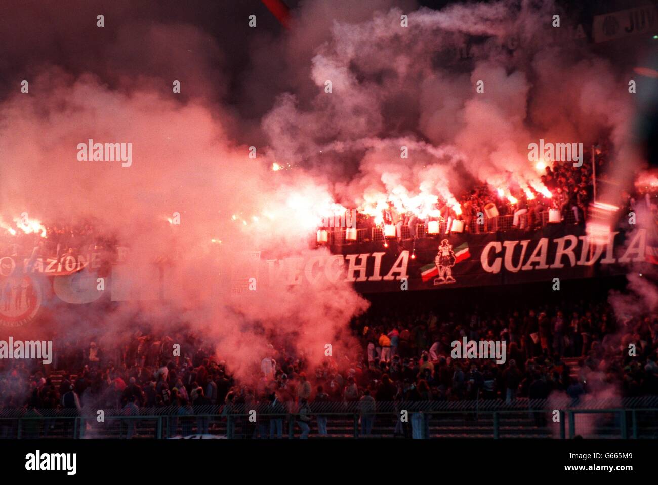 UEFA CHAMPIONS LEAGUE - JUVENTUS V NANTES ATLANTIQUE. Juventus fans set off flares in the Stadio Delle Alpi Stock Photo