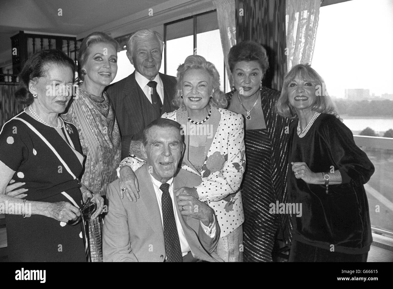 Hollywood stars of the 40s and 50s attend a party in London, before they board a luxury liner for an 8-day cruise to New York, on which a film festival is taking place. (l-r) Joan Bennett, Anne Jeffreys, Senator George Murphy, Fred MacMurray (front), June Haver, Esther Williams and Beverley Garland. Stock Photo