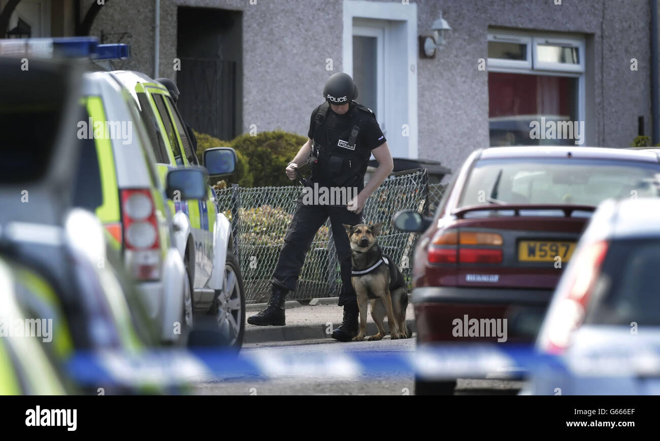 Police outside a flat in the Heathryfold area of Aberdeen, responding to an incident involving a man who remains inside. Stock Photo