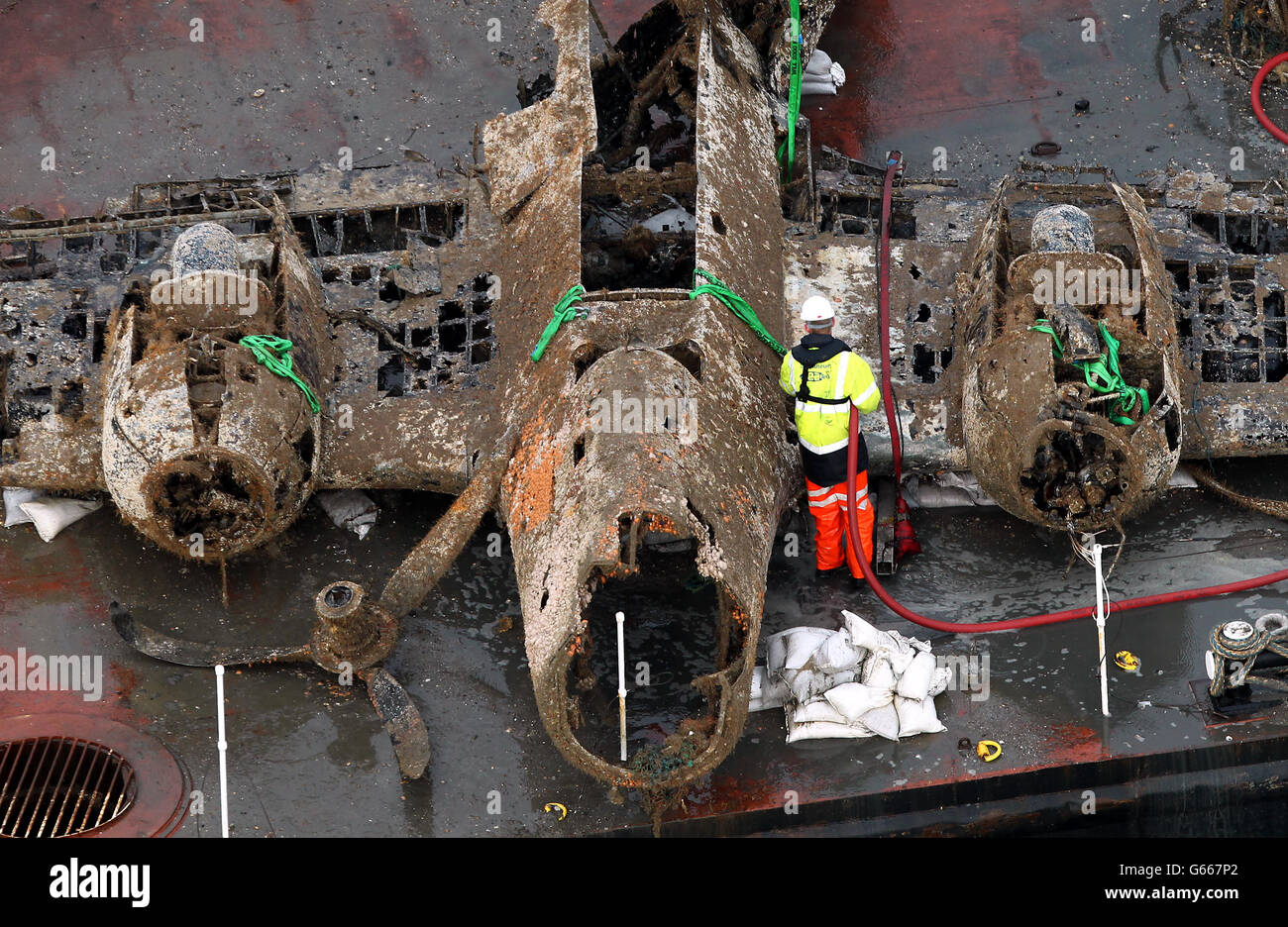 The remains of a crashed World War II Dornier bomber, the only surviving German Second World War Dornier Do 17 bomber, lays on a barge near Deal in the English Channel after being raised from the sea bed yesterday Evening. Stock Photo