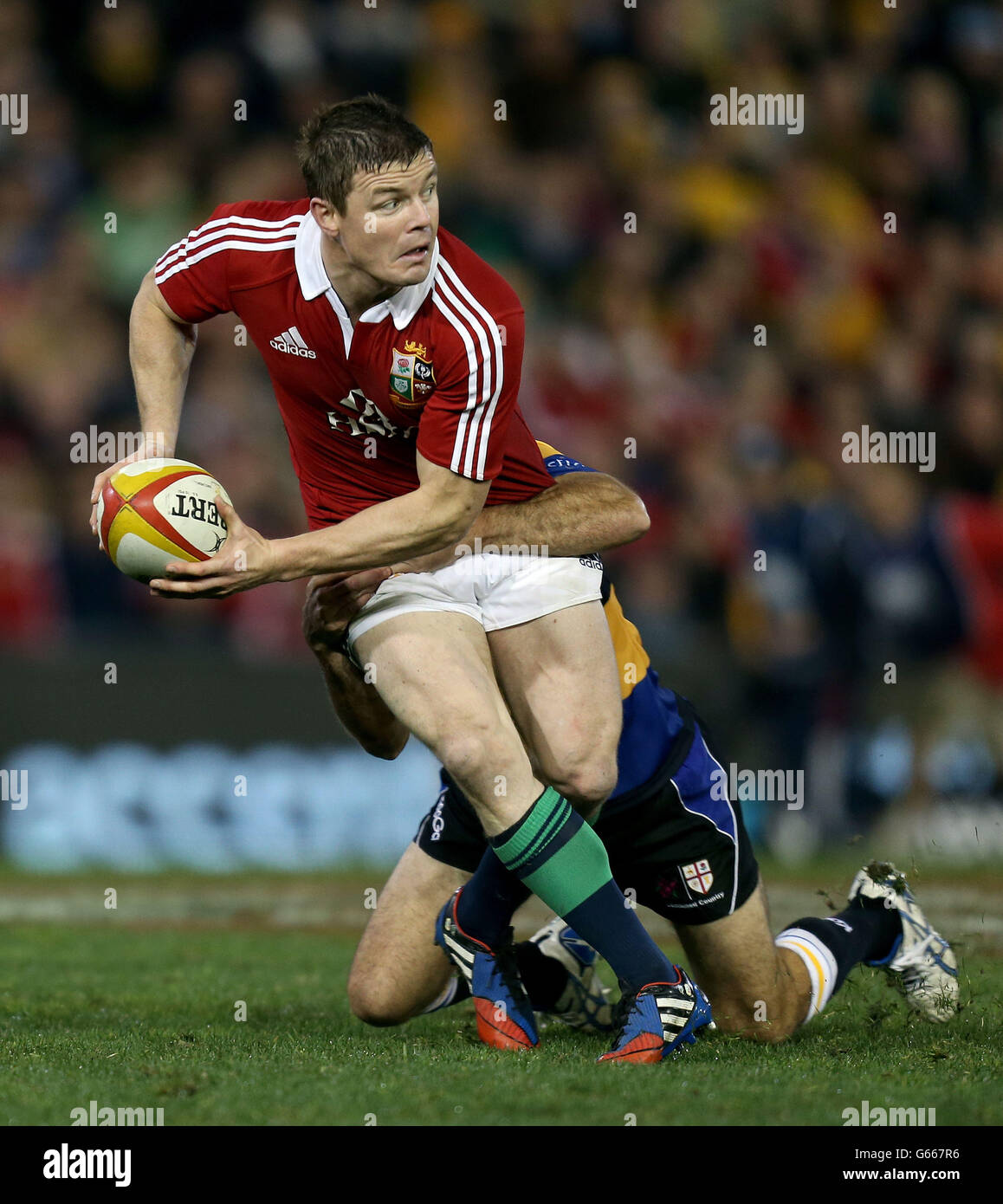 Lions Brian O'Driscoll is tackled by Country's Shaun McCarthy during British and Irish Lions Tour match at the Hunter Stadium, Newcastle, Australia. Stock Photo