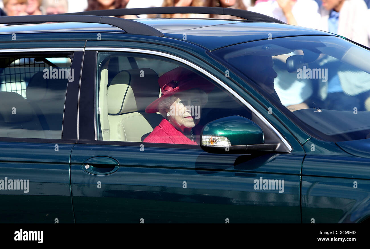 Queen Elizabeth Ii Drives A Jaguar Car As She Leaves The Cartier Queens Cup Polo Tournament