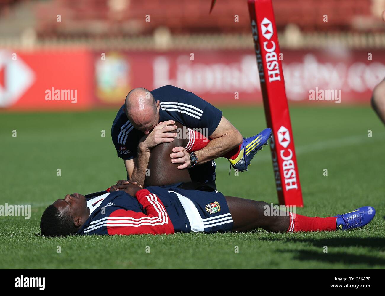 British and Irish Lions Christian Wade is stretched out by physio Phil Pask during a training