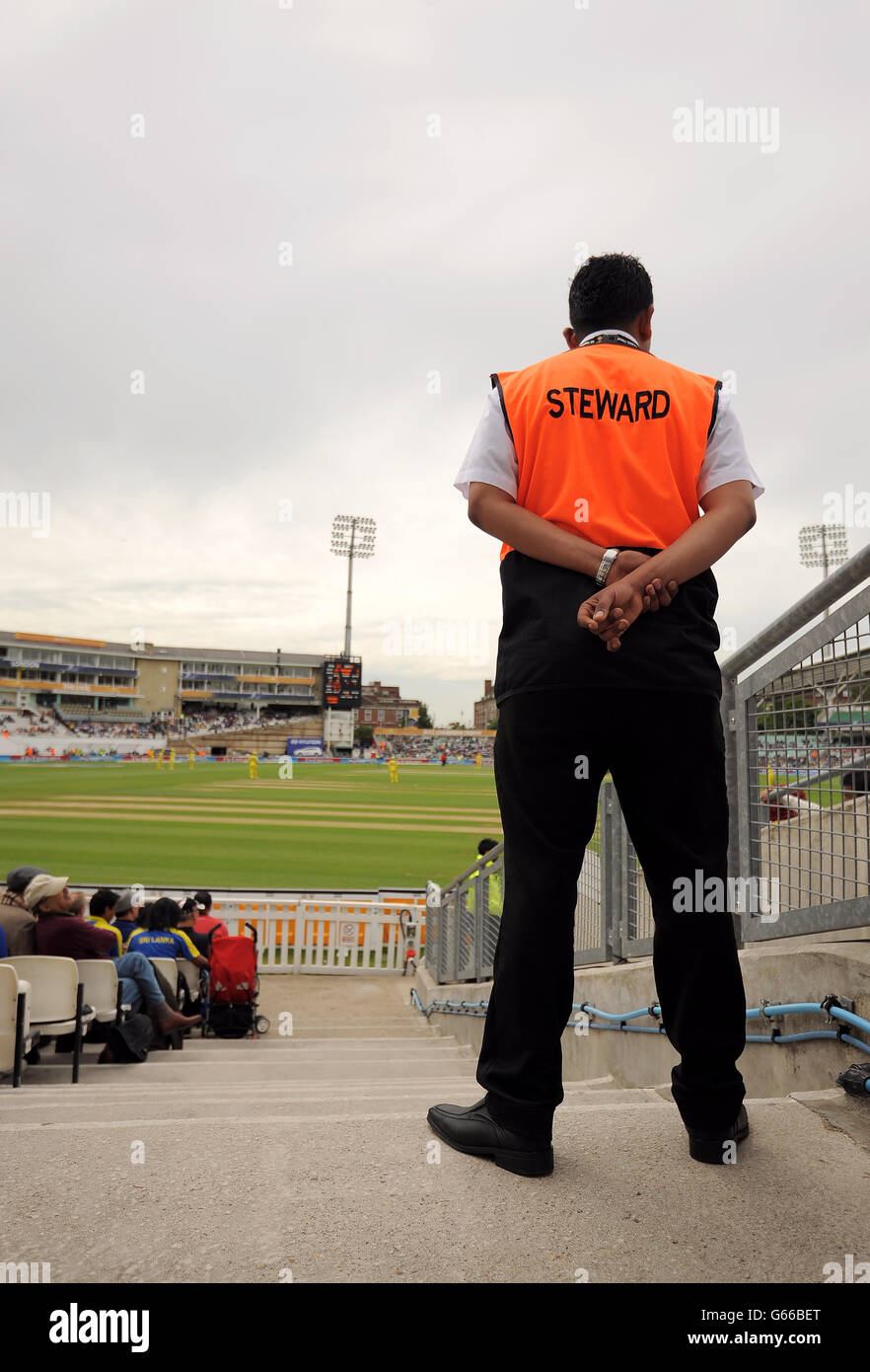 Steward mans an entrance to the at the kia oval hires stock