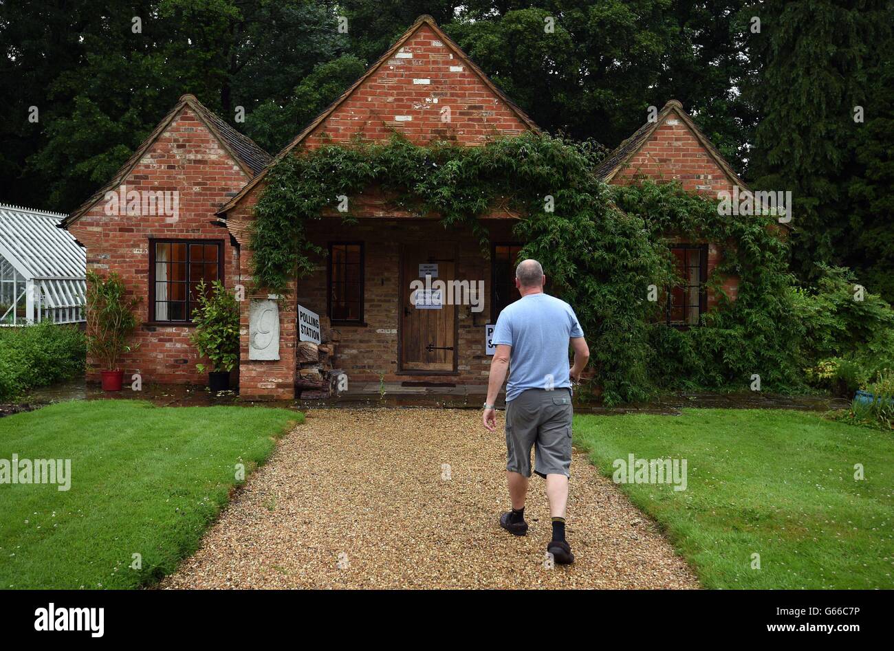 A member of the public walks towards a polling station being used in the EU referendum in a guest house annex in Dogmersfield, Hampshire. Stock Photo