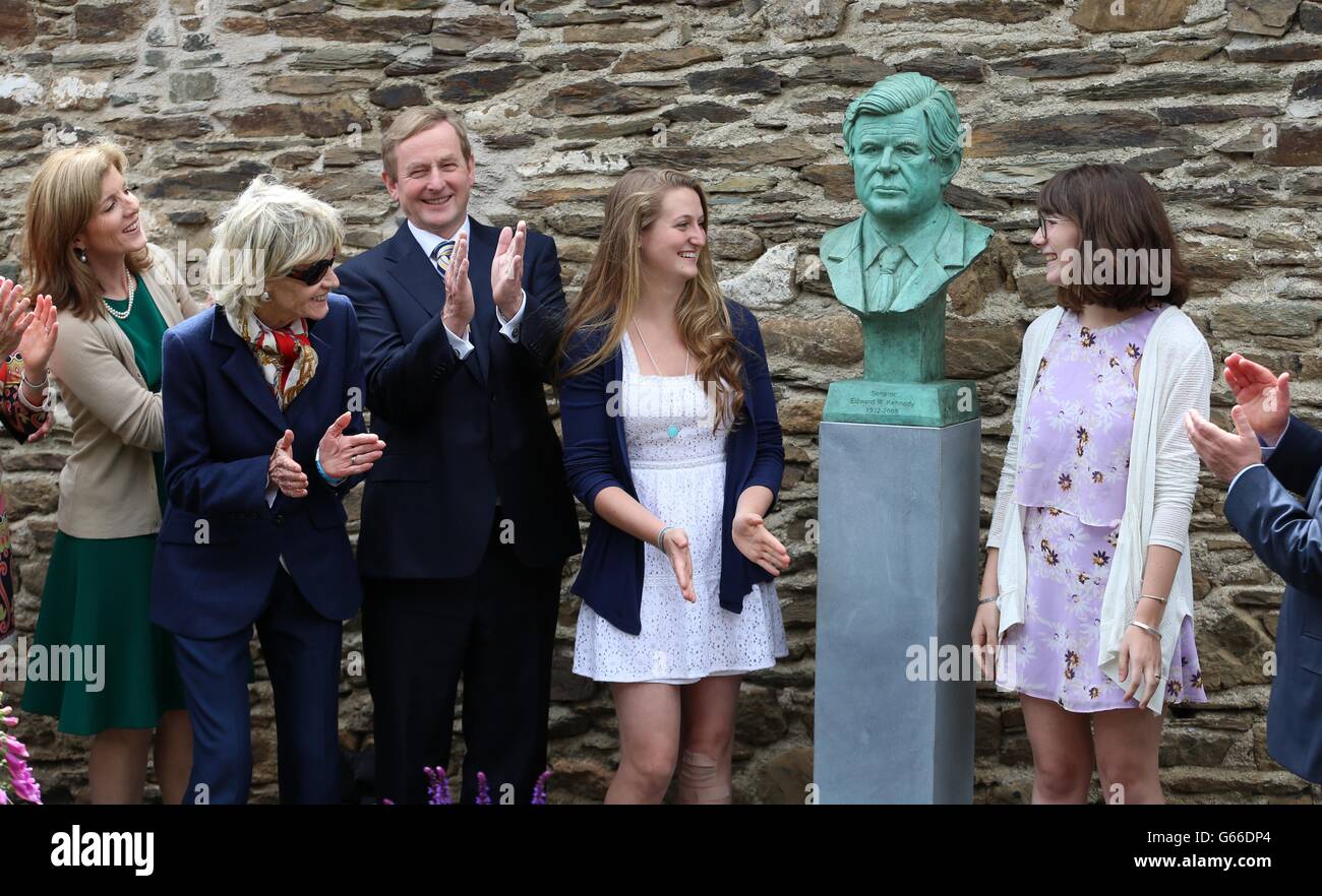 (left to right) Caroline Kennedy,Jean Kennedy Smyth and Taoiseach Enda Kenny look on as Ted Kennedys grand daughters Kyley and Grace unveil a bust of the late Senator at the Kennedy family homestead in Dunganstown, Co Wexford, as part of a celebration to mark the 50th anniversary of John F Kennedy's visit to Ireland. Stock Photo