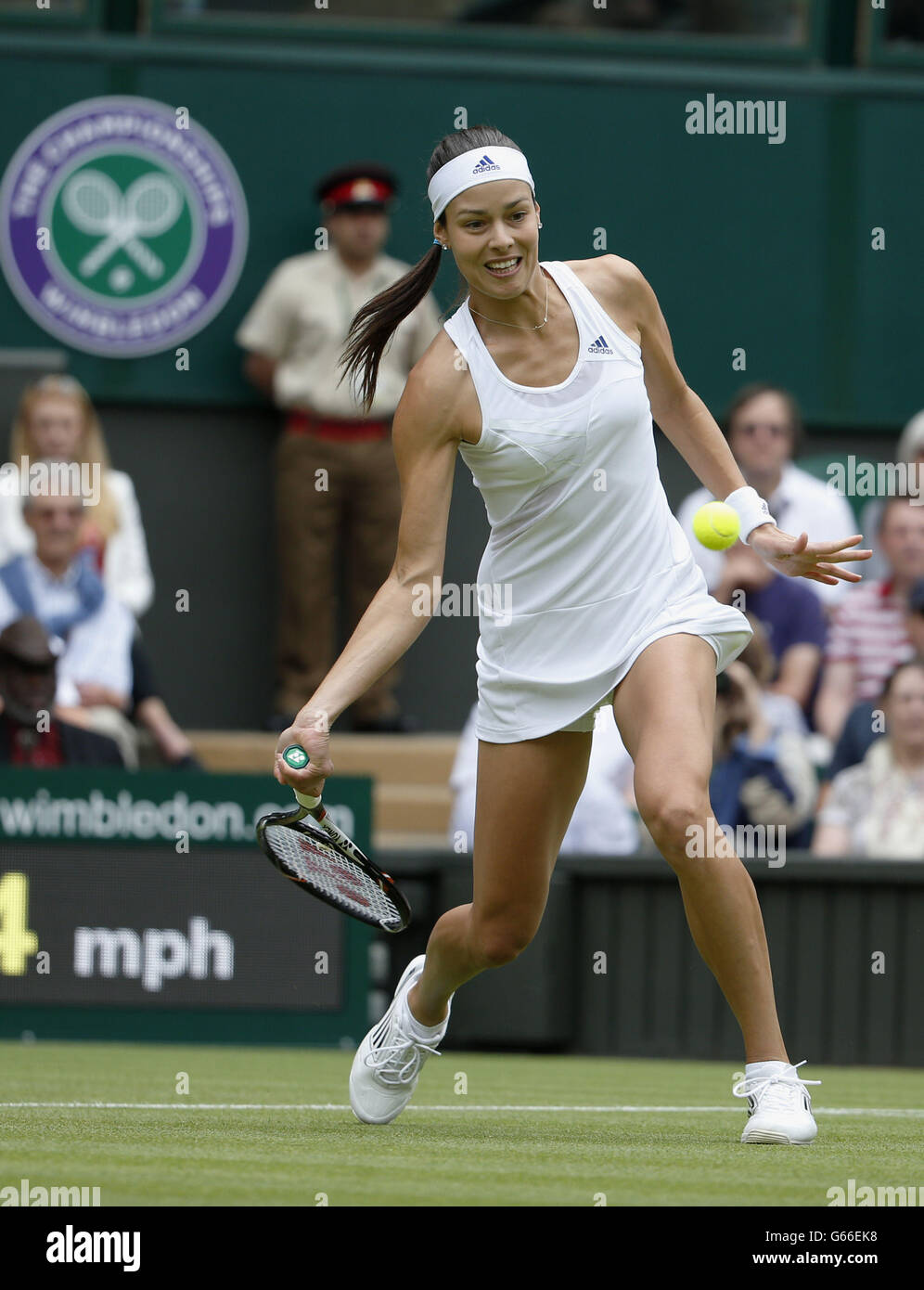 Serbia's Ana Ivanovic in action against Canada's Eugenie Bouchard during day Three of the Wimbledon Championships at The All England Lawn Tennis and Croquet Club, Wimbledon. Stock Photo