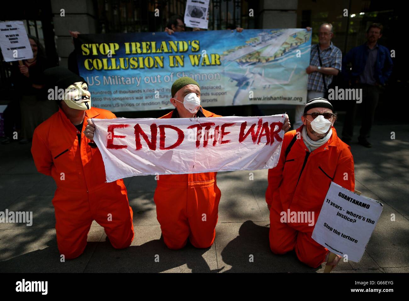Protestors mark International Day in support of Victims of Torture outside Leinster House in Dublin by calling for the closure of Guantanamo Bay and for the Irish Government to end Ireland's allowance of Shannon Airport to be used by America's military. Stock Photo