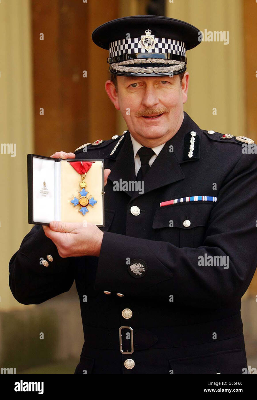 Mr John Giffard, the Chief Constable of Staffordshire Police, with his CBE which was presented to him by the Prince of Wales, at Buckingham Palace. Stock Photo