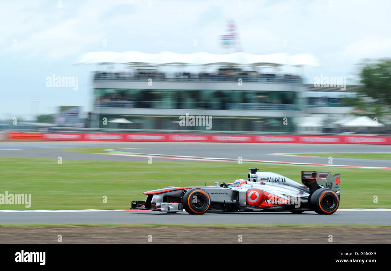 McLaren Mercedes driver Jenson Button goes past the British Racing ...