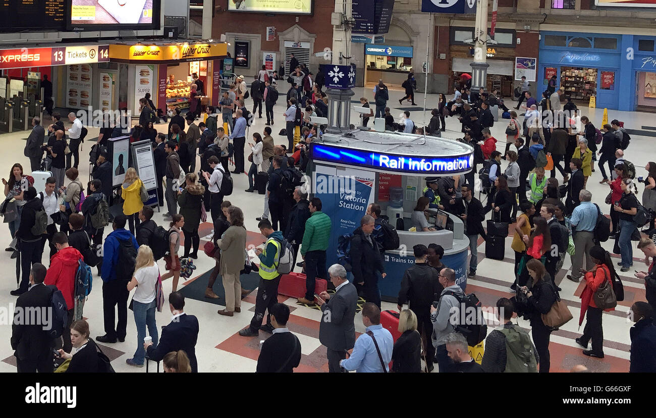 Commuters at Victoria Station, London, as torrential downpours and flooding swamped parts of London and the South East in the early hours of EU referendum day, with the London Fire Brigade inundated with a day's calls in just 90 minutes. Stock Photo