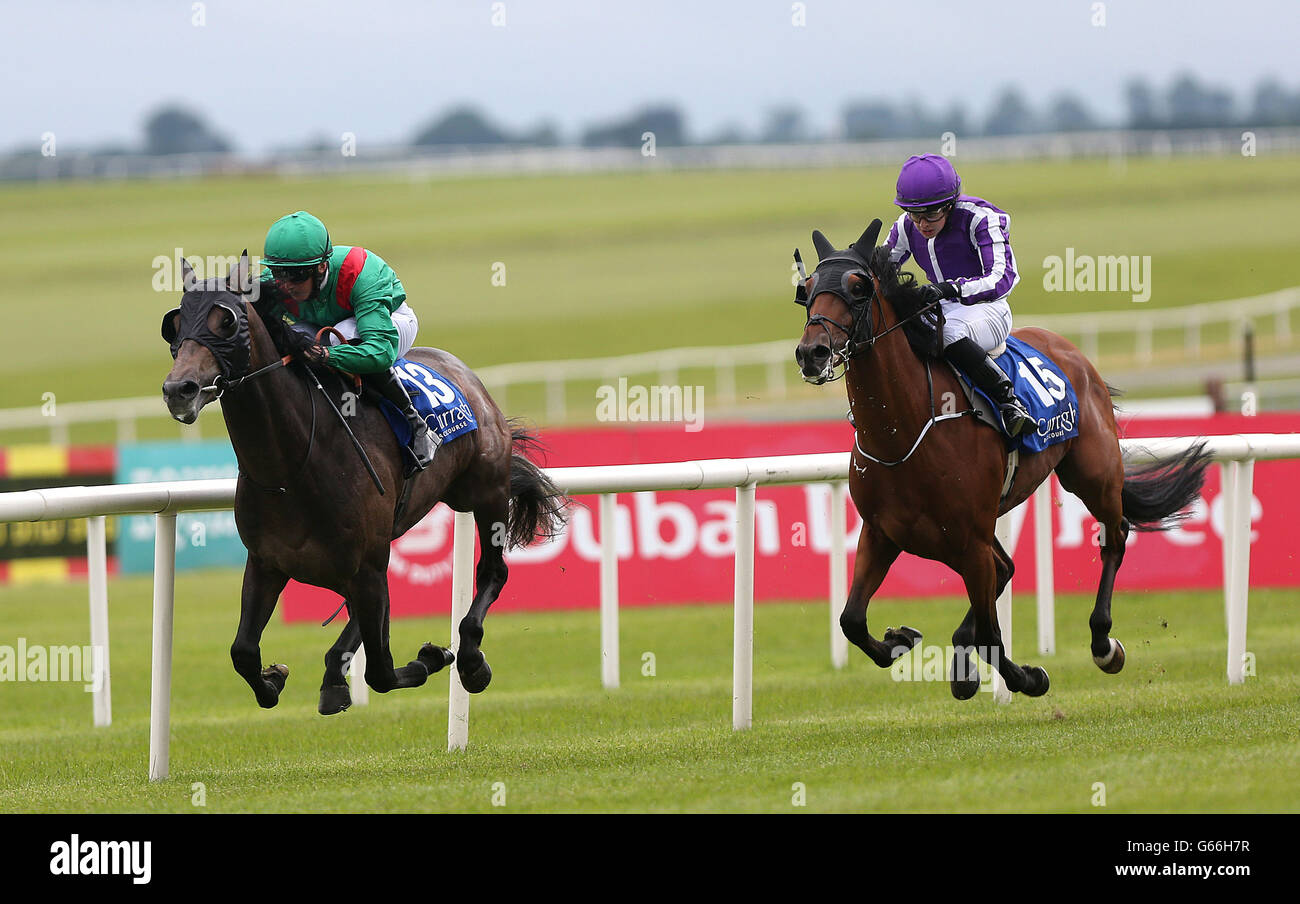 Mourani ridden bu Marc Monaghan races clear of King of the Romans ridden by Ana O'Brien to win the Eflow Reward card Apprentice Derby during the eFlow rewardcard Derby Festival Friday at Curragh Racecourse in Co. Kildare, Ireland. Stock Photo