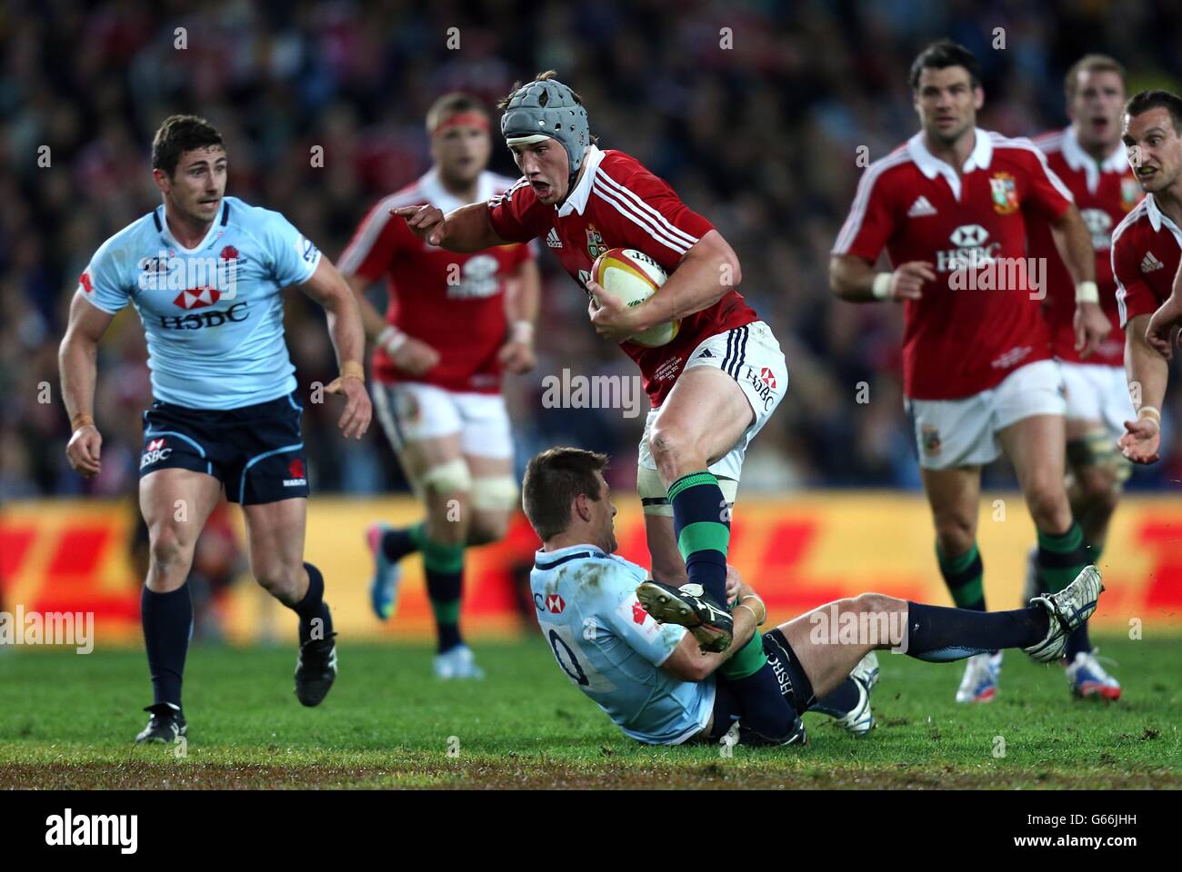 British & Irish Lions' Jonathan Davies tries to escape the tackle from NSW Waratahs' Bernard Foley Stock Photo