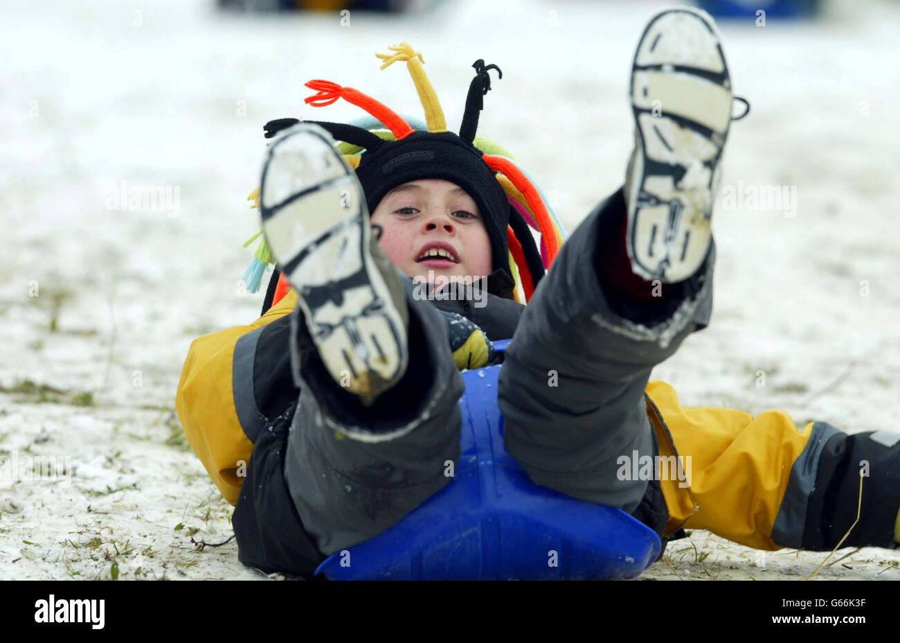 SLEDGING IN WINTER SNOW Stock Photo - Alamy