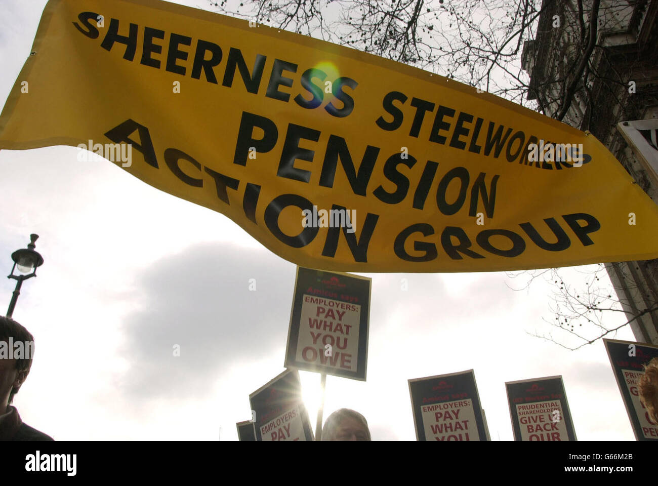 Members of the Sheerness Steelworkers Pension Action Group march along Whitehall in Westminster, central London, as they joined around 400 engineering workers to protest against pensions being slashed after United Engineering Forgings (UEF) went into insolvency in 2001. *... The Transport and General Workers Union claimed the company's pension fund was 'raided' to pay for redundancies, threatening pension payments to about 1,300 staff at UEF factories in Ayr, the Midlands and Yorkshire. Stock Photo