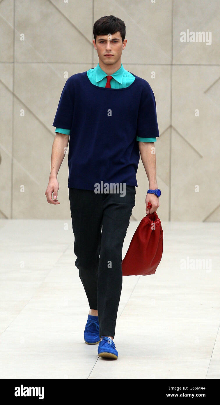 A model on the catwalk at The Burberry Prorsum show at the London  Collections: MEN SS14 at Kensington Gardens in London Stock Photo - Alamy