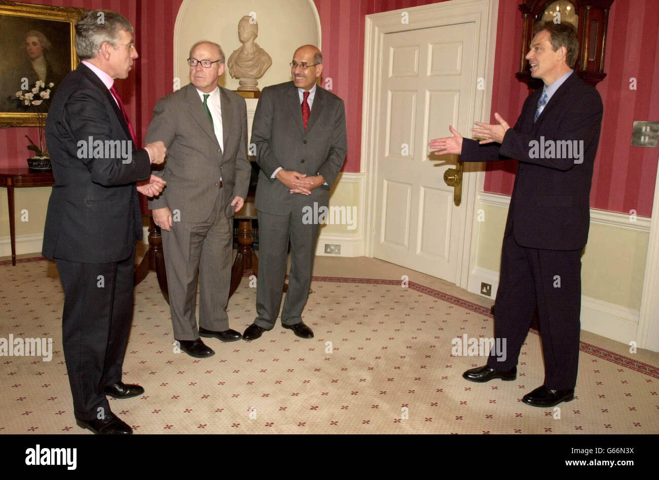 British Prime Minister, Tony Blair (right), with British Foreign Secretary Jack Straw (left), the United Nations Cheif Weapons Inspector, Hans Blix, (second left) and the Head of International Atomic Energy Agency Mohamed El Baradei, at 10 Downing Street. * Mr El Baradei said Saddam Hussein s regime needed to show progress by the time the inspectors produced their next report to the UN on February 14. Stock Photo