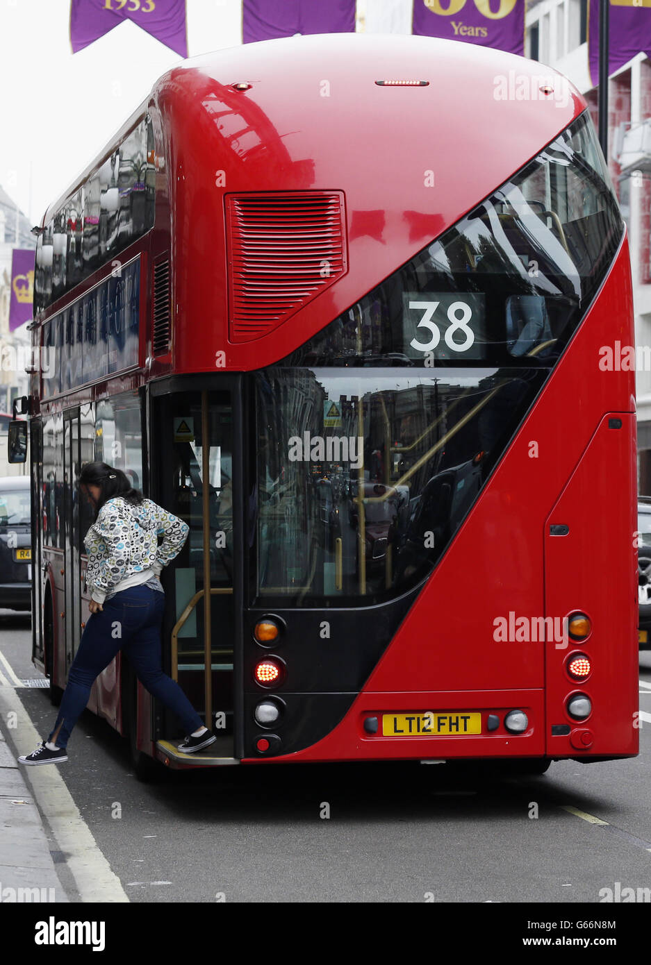 The new Routemaster bus used on the 38 route passes along Piccadilly, London. Services will start tomorrow on the first route to be served entirely by the new generation of hop-on, hop-off 'Boris buses'. Stock Photo