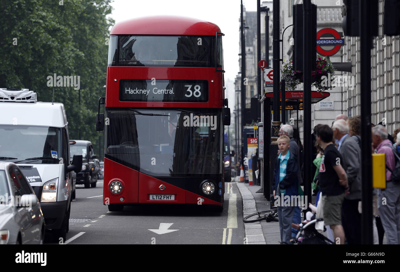 The new Routemaster bus used on the 38 route passes Green Park underground station on Piccadilly, London. Services will start tomorrow on the first route to be served entirely by the new generation of hop-on, hop-off 'Boris buses'. Stock Photo