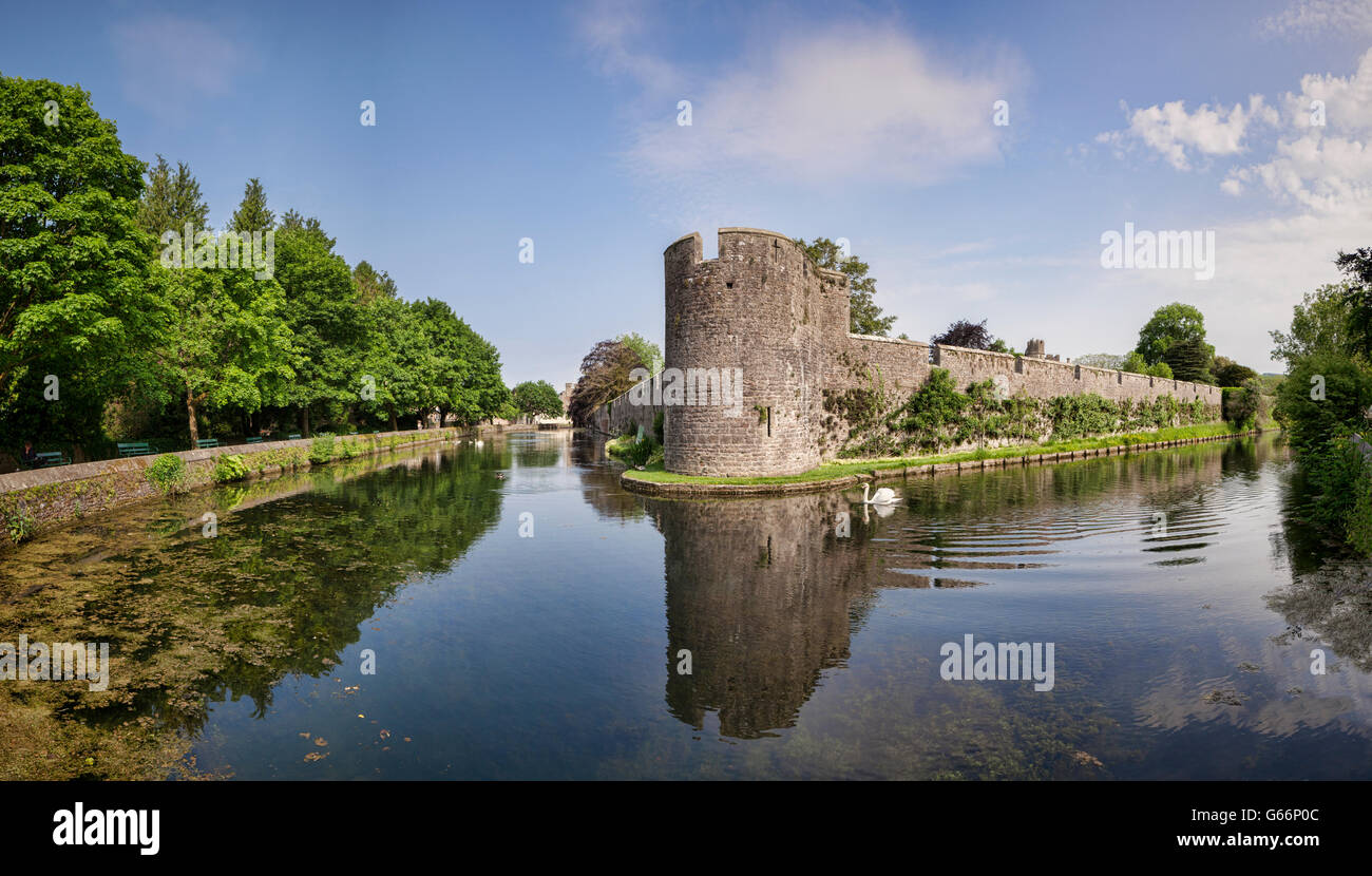 Panorama of the outer walls and moat of the Bishop's Palace in Wells, Somerset,England, UK. Stock Photo