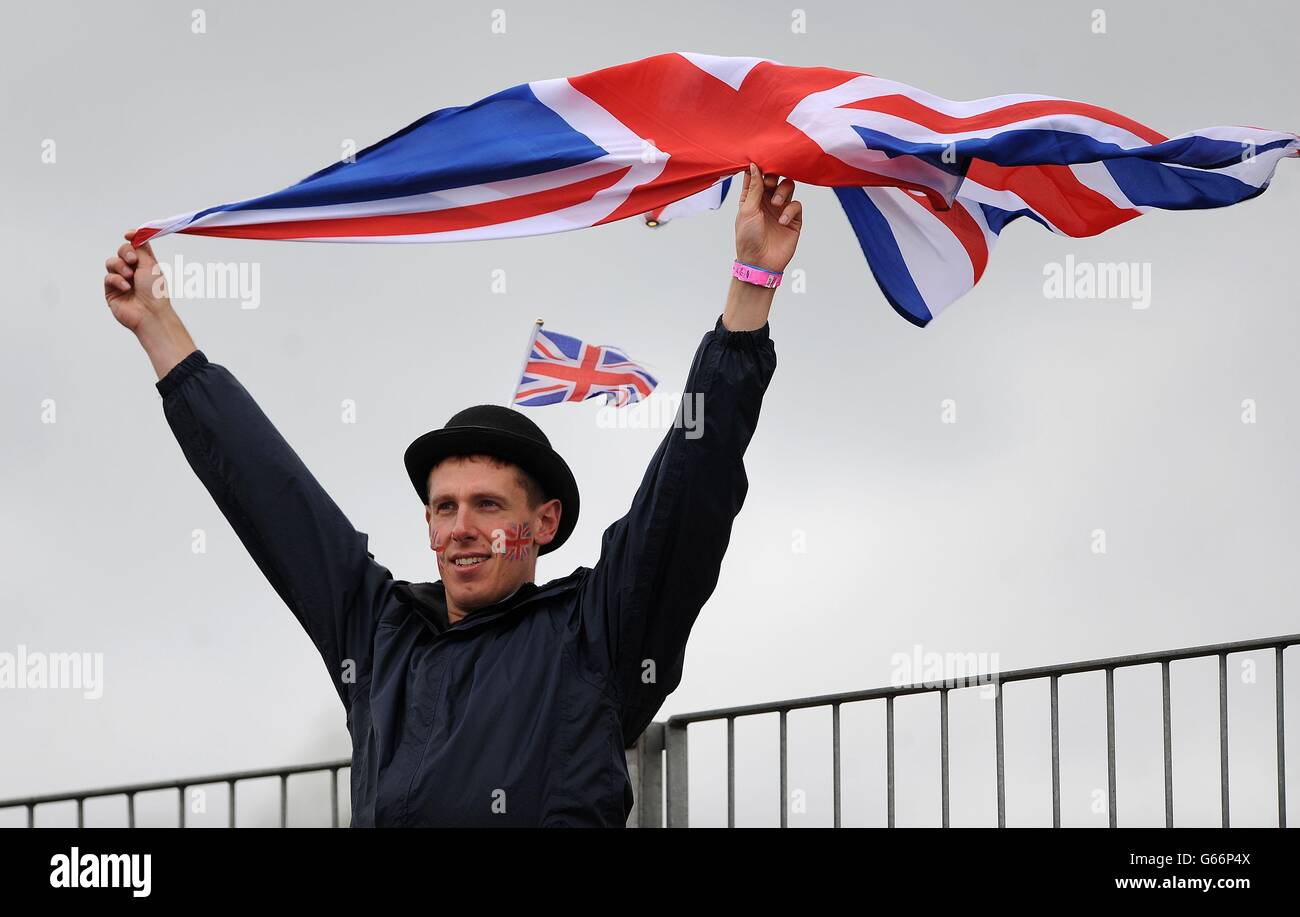 A spectator waves the Union Jack during day three of the Rowing World Cup at Eton Dorney, Buckinghamshire. Stock Photo