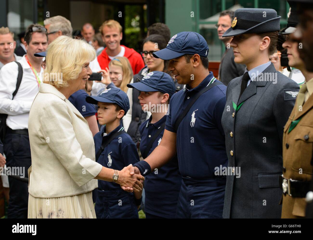 The Duchess of Cornwall meets ballboy Dhilan Patel during a visit to the Wimbledon Tennis Championships at the All England Lawn Tennis and Croquet Club, Wimbledon. Stock Photo