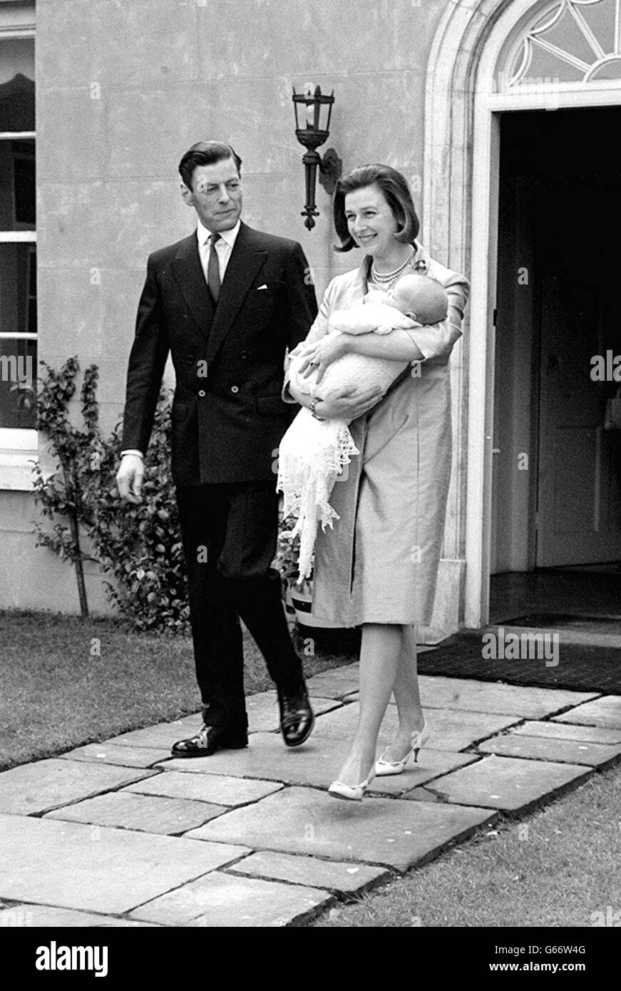 Princess Alexandra cradles her infant son James Robert Bruce in her arms as, with Mr Angus Ogilvy, she leaves her home at Thatched House Lodge, Richmond Park. 26/12/04: Sir Angus Ogilvy died. Stock Photo