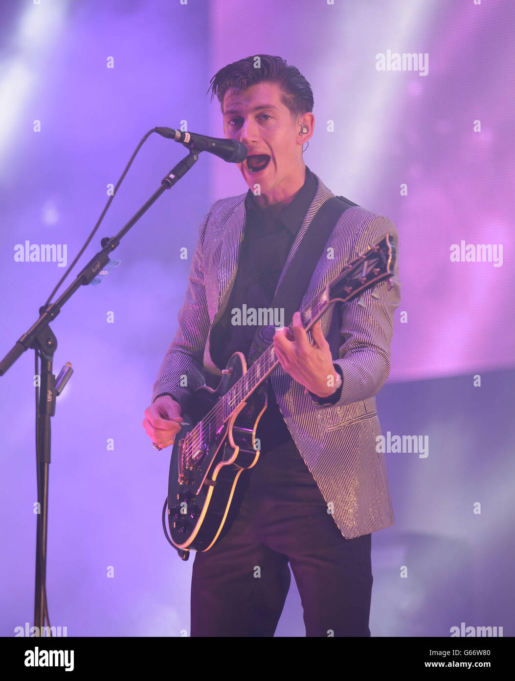 Alex Turner of the Artic Monkeys performing on the Pyramid Stage, during the first performance day of the Glastonbury 2013 Festival of Contemporary Performing Arts at Pilton Farm, Somerset. Stock Photo