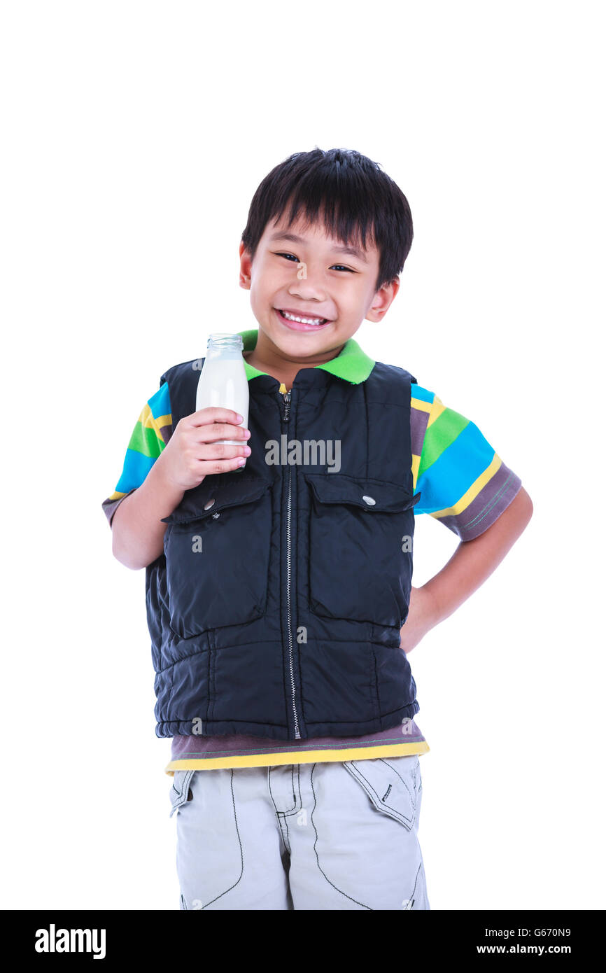 Fun portrait of handsome asian boy smiling and holding bottle of milk. Drinking milk for good health. Stock Photo