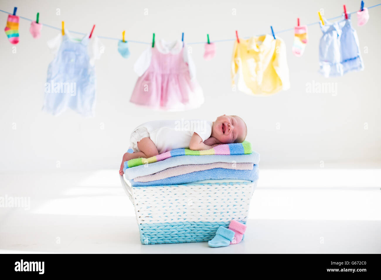 Newborn baby on a pile of clean dry towels. New born child after bath