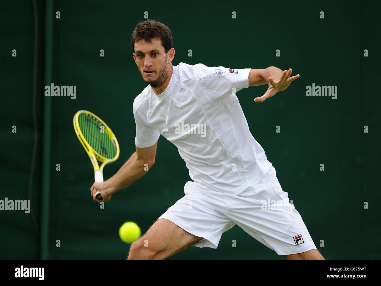 Tennis - 2013 Wimbledon Championships - Day One - The All England Lawn Tennis and Croquet Club. Great Britain's James Ward in action against Chinese Taipei's Yen-Hsun Lu Stock Photo