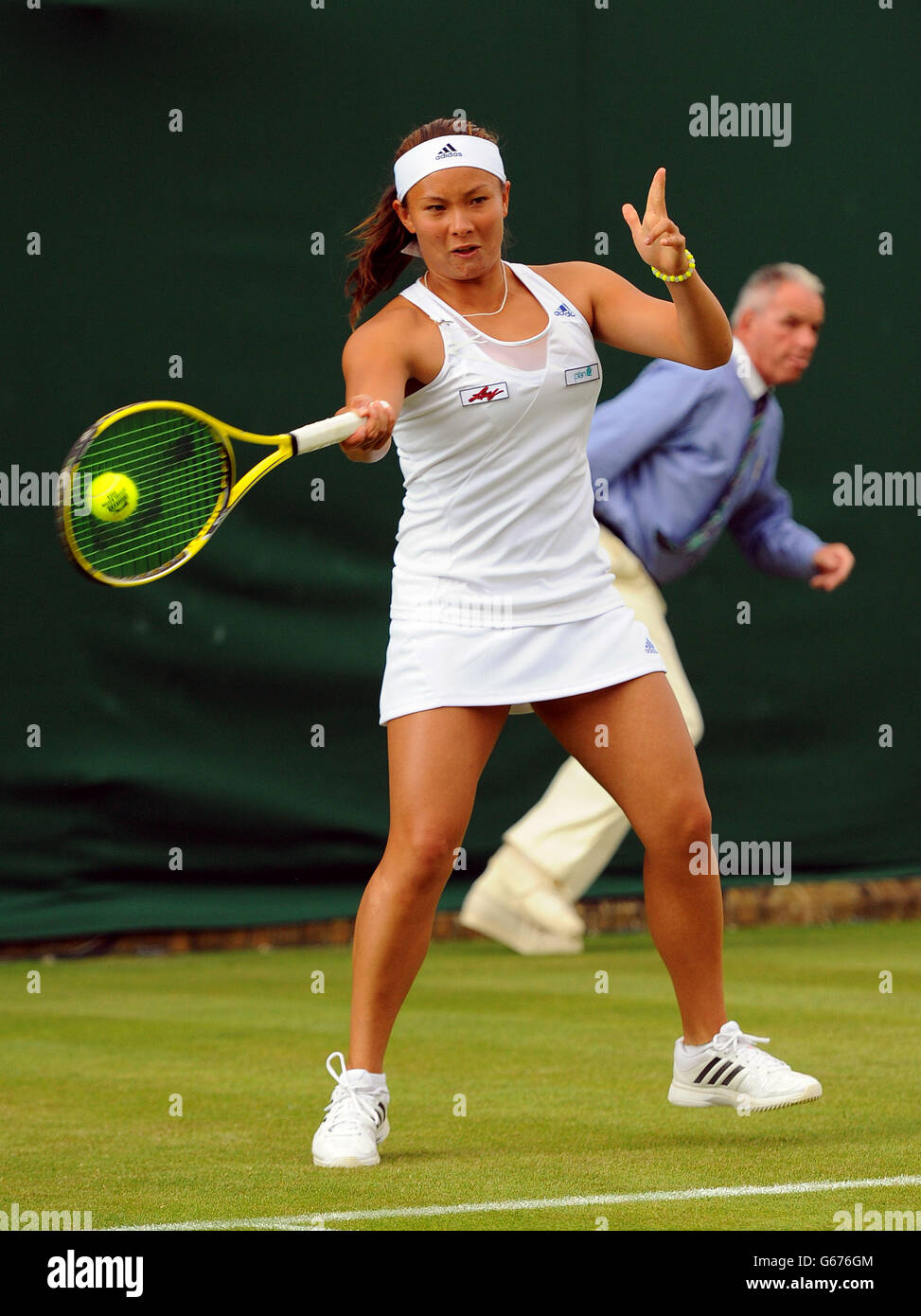 Great Britain's Tara Moore in action against Estonia's Kaia Kanepi during  day Two of the Wimbledon Championships at The All England Lawn Tennis and  Croquet Club, Wimbledon Stock Photo - Alamy