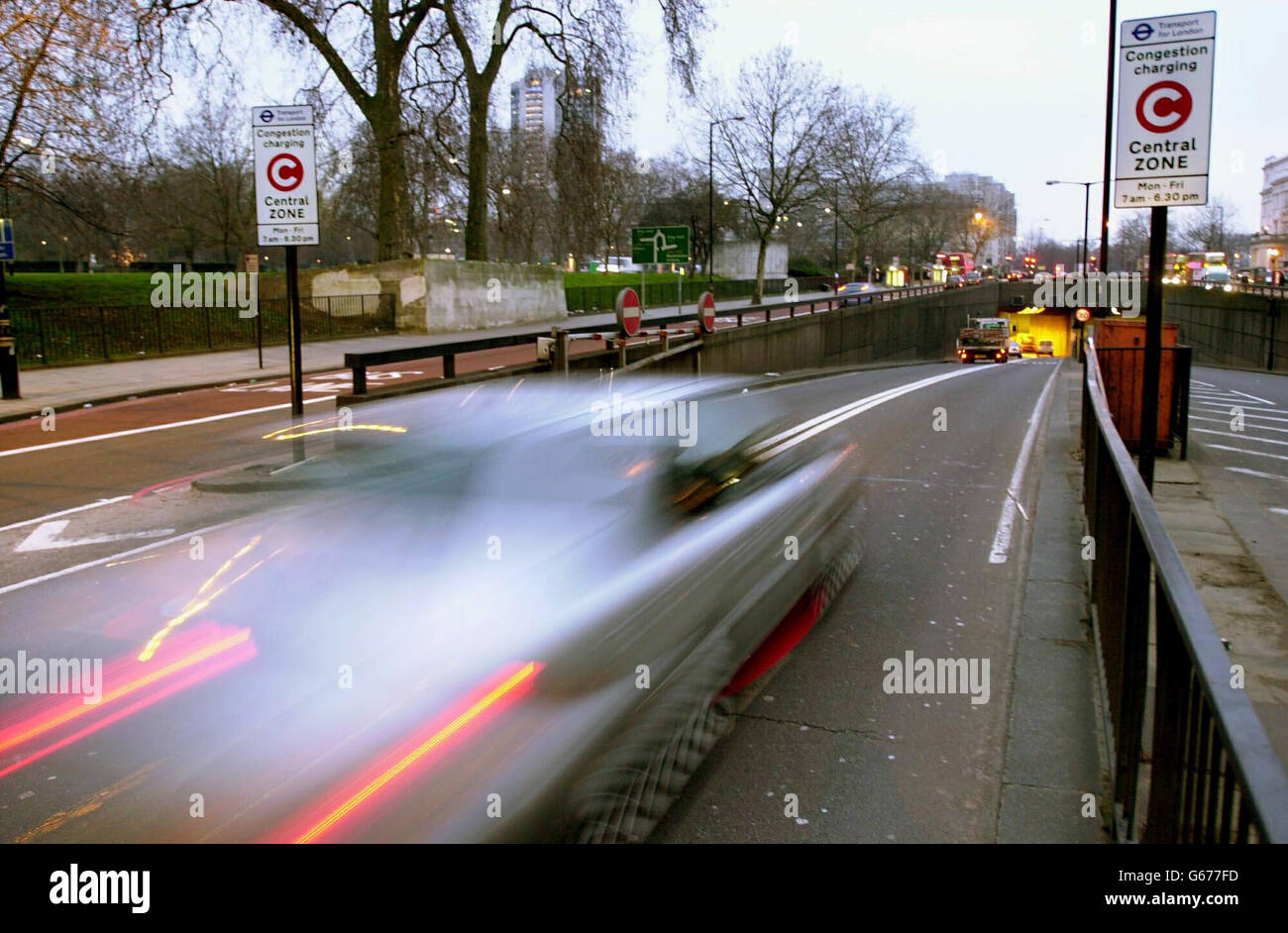 A motorist on its way into central London. From today drivers using an eight mile square zone of the capital between 0700 and 1830 Monday to Friday have to pay a 5 charge. * Their payments are monitored against digitised images recorded by an array of about 700 cameras in and on the periphery of the zone. There are discounts for drivers living within the zone, and money raised from the scheme will go towards improving public transport. 27/08/2003: Commuters are taking risks on the road to spend more time with their loved ones, according to a survey out Wednesday August 27, 2003. Most (66%) Stock Photo