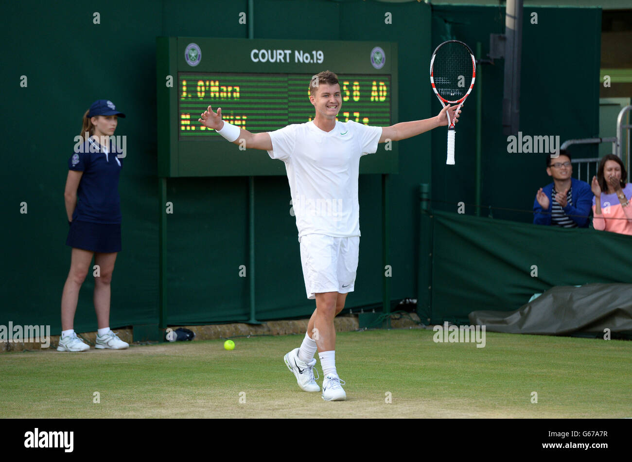 Great Britain's Jonny O'Mara celebrates defeating France's Maxime Janvier in his Boy's Singles match during day seven of the Wimbledon Championships at The All England Lawn Tennis and Croquet Club, Wimbledon. Stock Photo