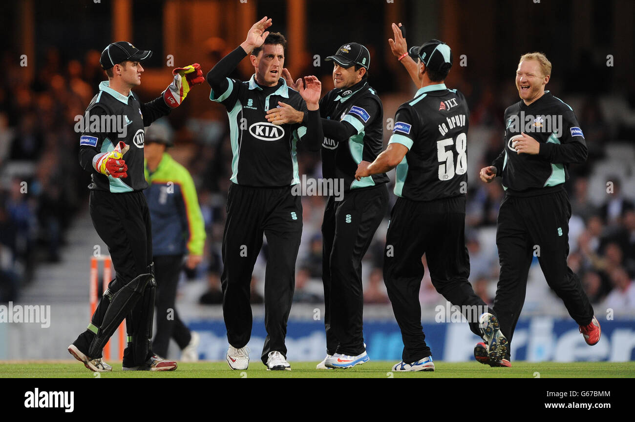 Surreys jon lewis celebrates after trapping sussex smith lbw hires