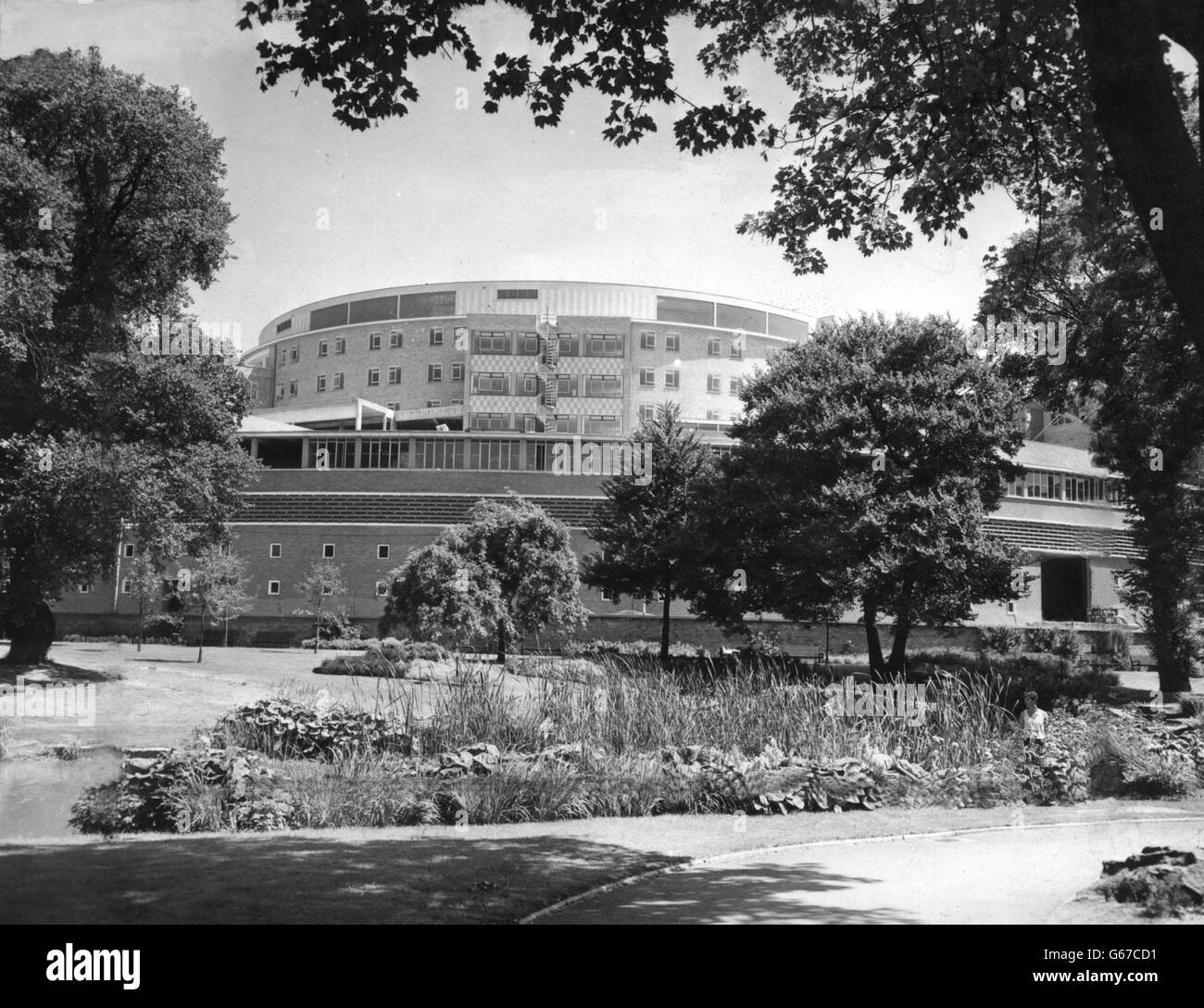 The vast circular building which forms the main block of the British Broadcasting Corporation's 10,000,000 Television Centre in Wood Lane. When finished the building, shaped like a qiant question mark, and designed by Mr Graham Dawbarn, FRIBA, will be Europe's biggest TV centre. Stock Photo
