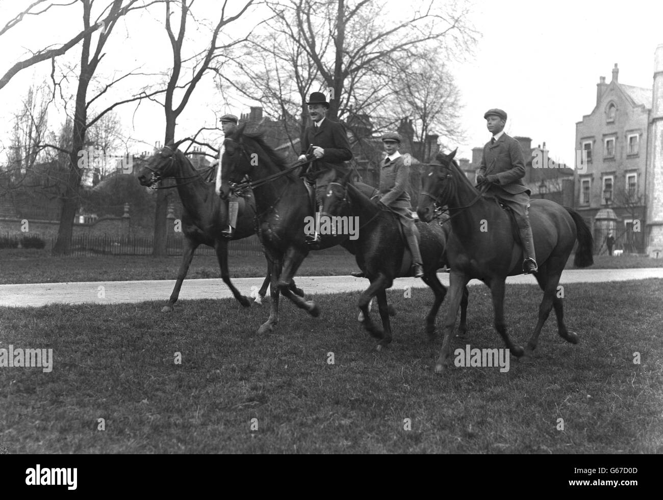 Royalty - Horseback riding - Prince of Wales, Major Clive Wigram, Prince Henry and Prince Albert. The Prince of Wales, Major Clive Wigram, Prince Henry and Prince Albert out riding on horses. 1911. Stock Photo