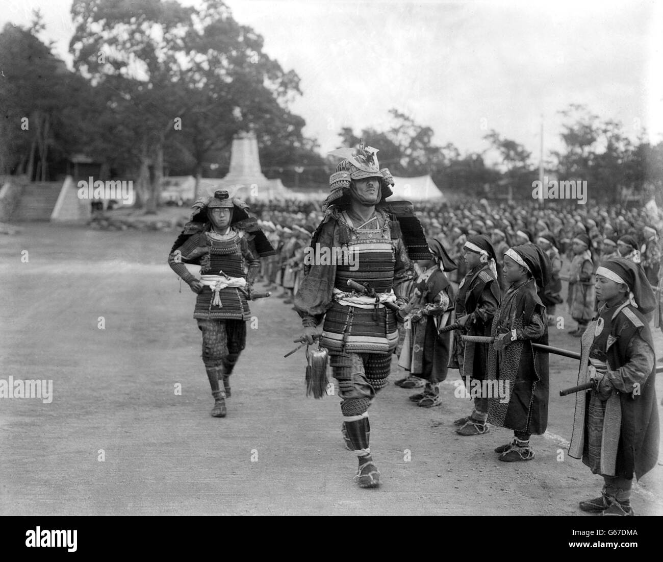 Japanese in the costume of ancient Shimatsu warriors who paraded before the Prince of Wales. Stock Photo