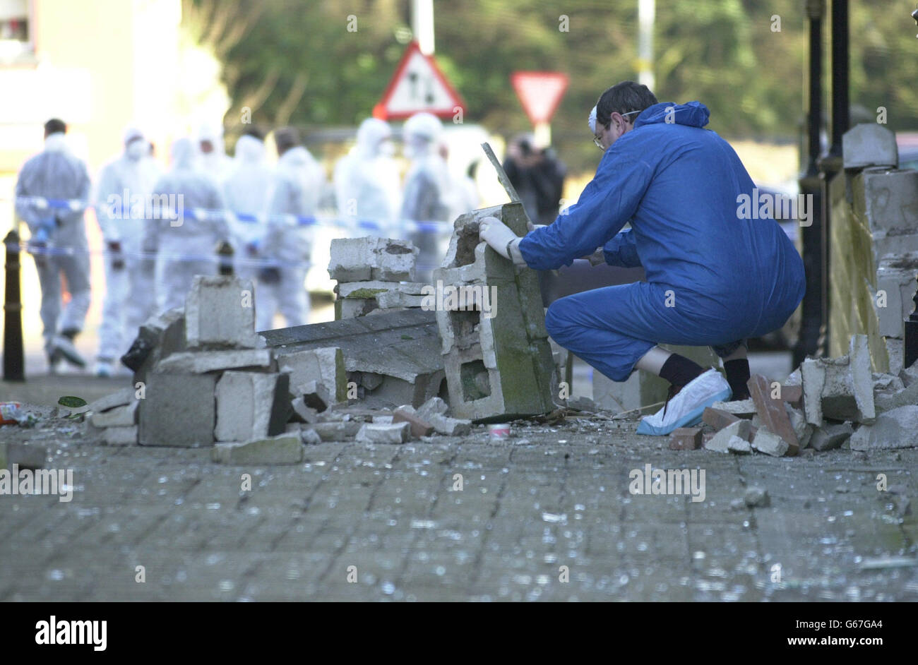 Police forensics teams examine rubble from a blast outside Enniskillen Town Hall, Enniskillen, County Fermanagh, Northern Ireland. As Prime Minister Tony Blair and Irish premier Bertie Ahern prepared for talks tomorrow in Hillsborough Castle, * .. with the province's parties to revive devolution, the Continuity IRA claimed it planted the bomb which exploded last night at around 7.10pm. Stock Photo
